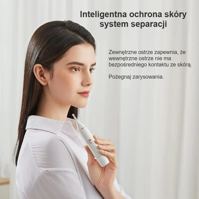 Kobieta trzyma trymer do nosa, prezentacja zewnętrznego ostrza chroniącego skórę