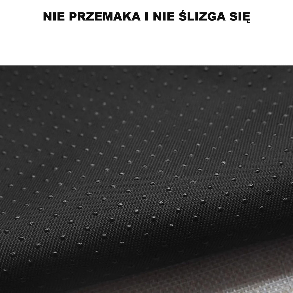 Czarny, antypoślizgowy spód legowiska w kropki z bliska
